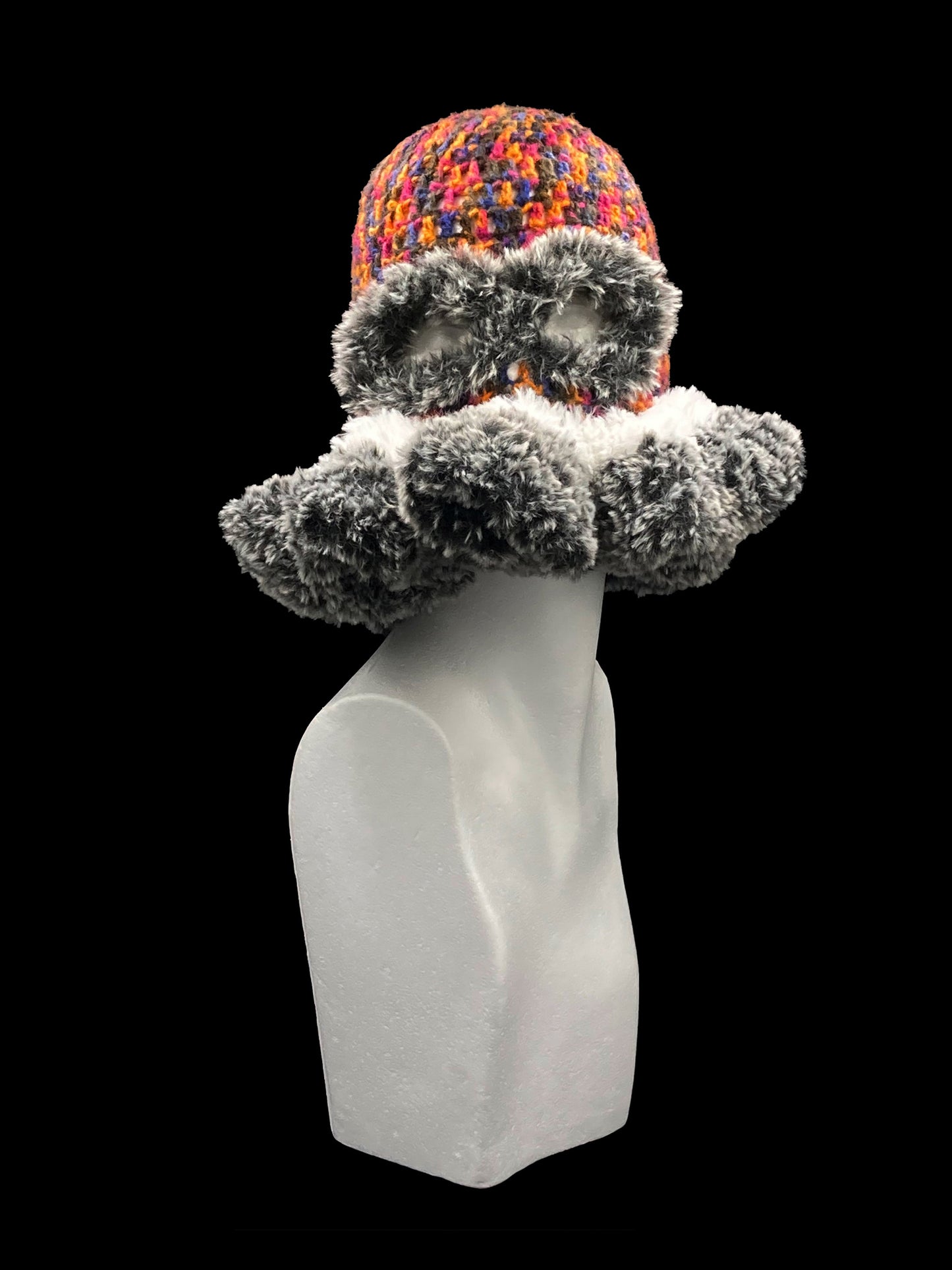 Handmade crochet balaclava with an open-eye and a waved-edge design, featuring a bold mix of black, orange, pink, blue, grey and white. Unisex, one size fits all