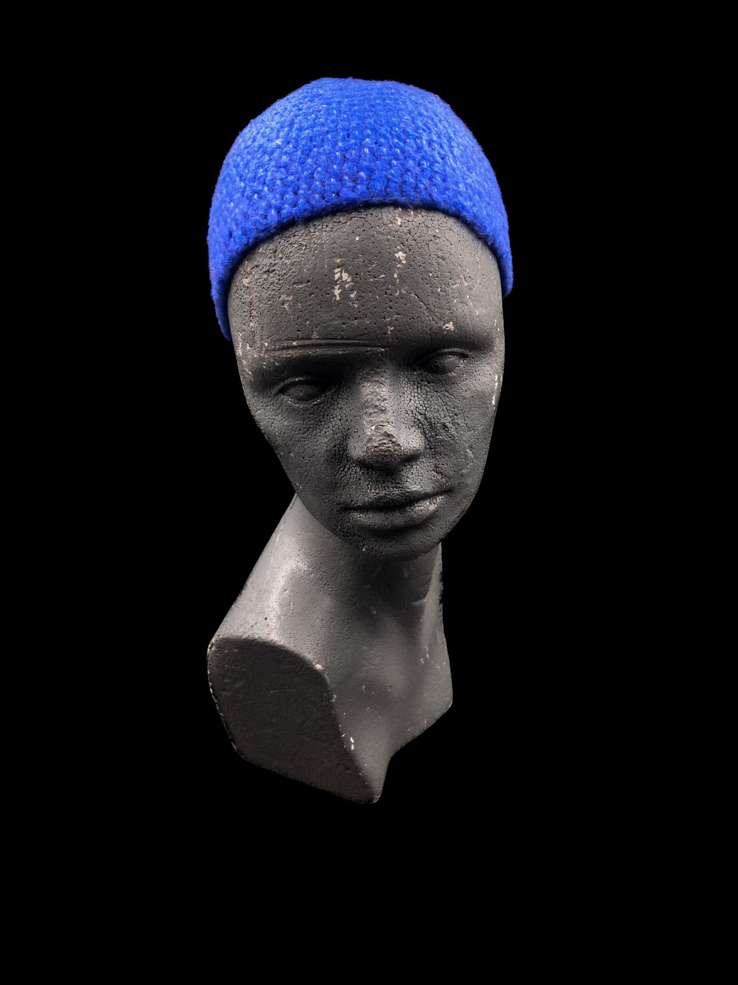Handmade crochet beanie, deep blue. Designed for a unisex fit, small size.