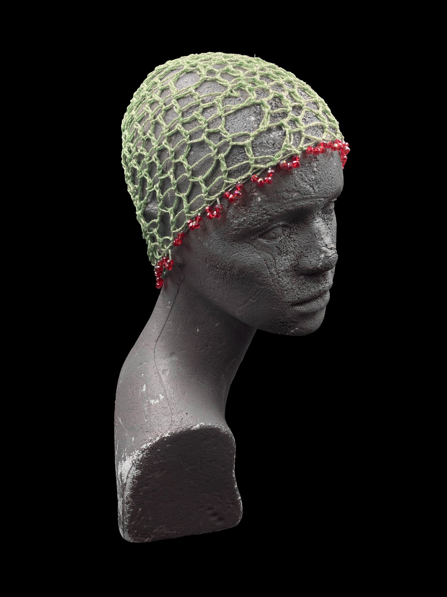 Handmade crochet beanie, emerald green with red beads. Designed for a unisex fit, one size fits all.