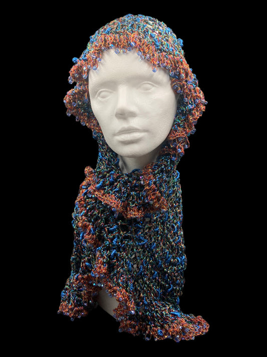 Handmade crochet Tarha in shimmering blue, copper, green, and black tones, with blue beads details and airy openwork, perfect for summer and wearable in various ways on the head and shoulders
