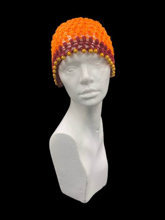 Handmade crochet hat, orange and bordeaux with gold beads. Designed for a unisex fit, one size fits all.