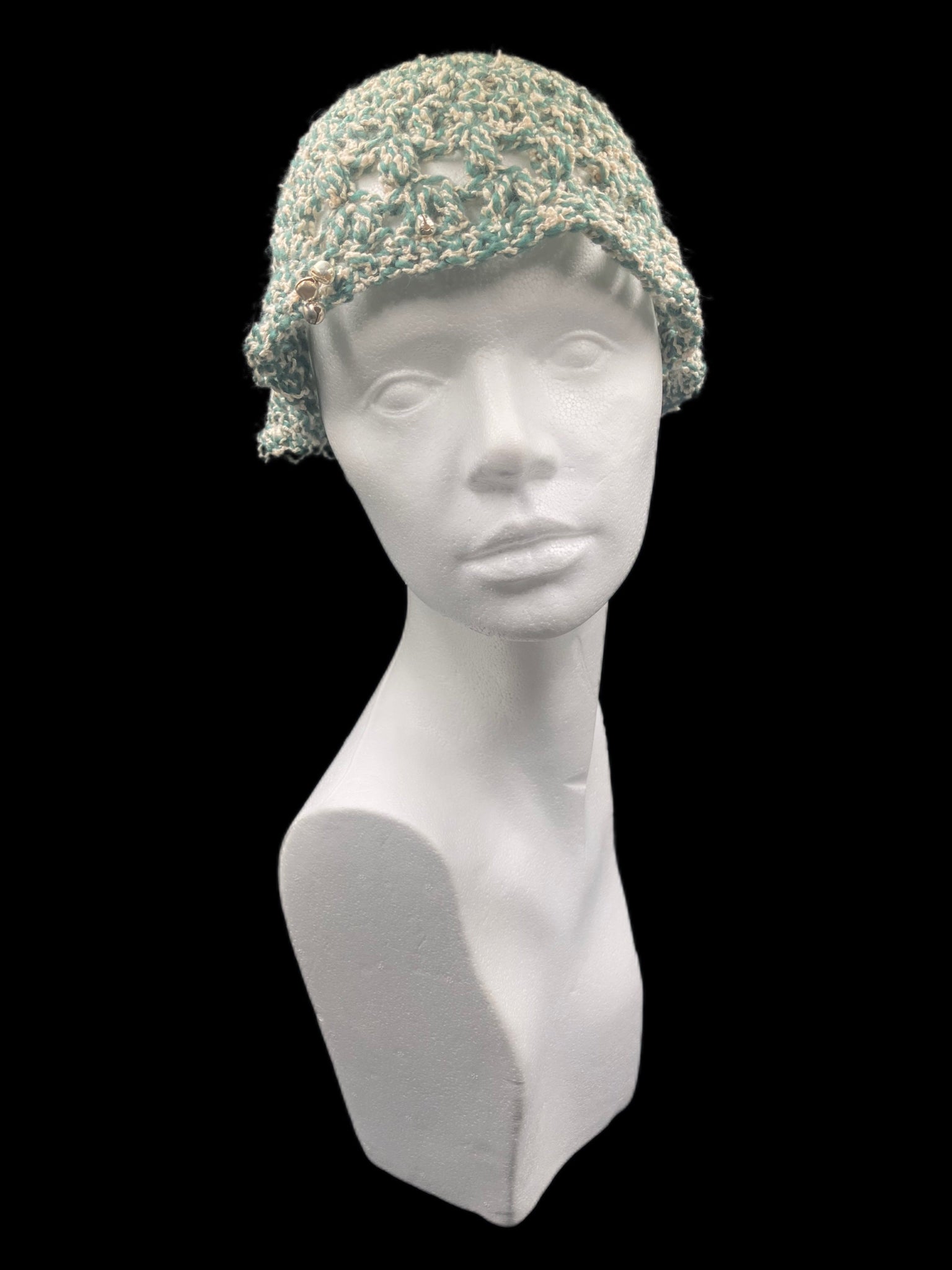 Handmade crochet hat, green and white. Designed for a unisex fit, one size fits all.
