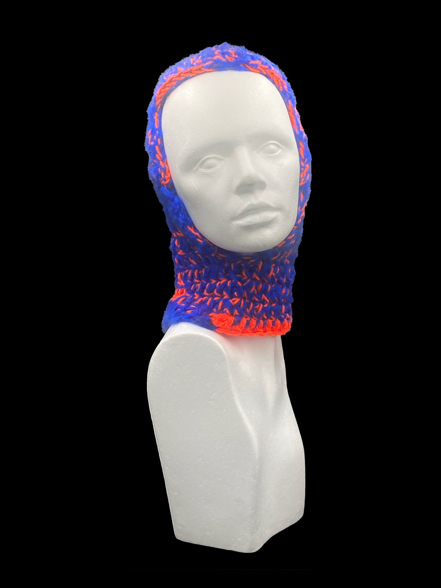 Handmade crochet balaclava with an open-face design, orange and blue. Designed for a unisex fit, one size fits all.

