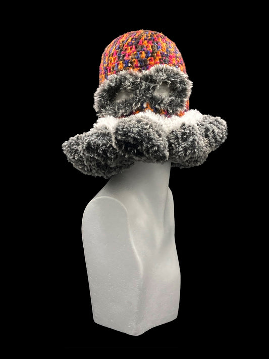 Handmade crochet balaclava with an open-eye and a waved-edge design, featuring a bold mix of black, orange, pink, blue, grey and white. Unisex, one size fits all