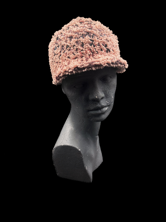 Handmade crochet beanie featuring a visor-style design in pink, dark grey and red. Unisex, one size fits all.

