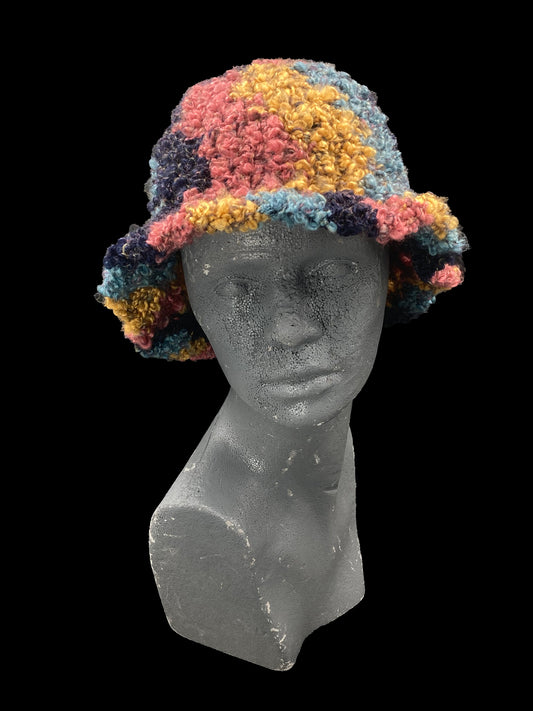 Handmade crochet bucket-hat, pink, yellow, dark and light blue. Designed for a unisex fit, one size fits all.