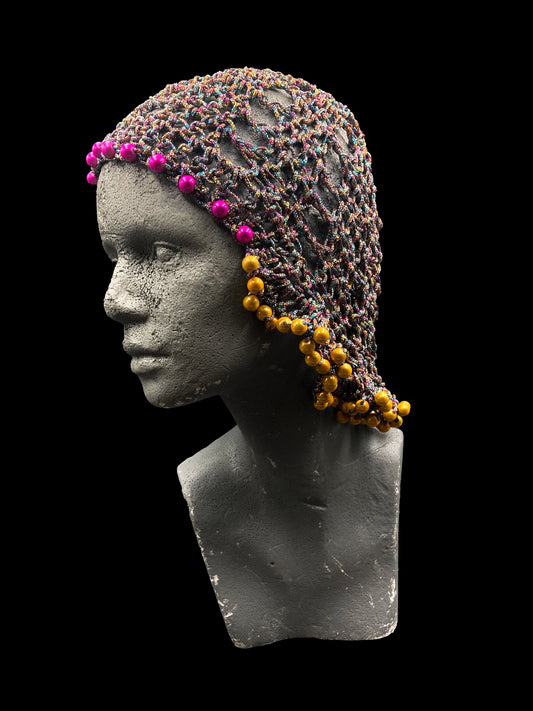 Handmade crochet headwear features a bold mullet-inspired design, shiny blue pink and yellow, with yellow and pink beads. Designed for a unisex fit, one size fits all.
