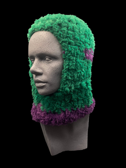 Handmade crochet balaclava with an open-face design, green and purple. Designed for a unisex fit, one size fits all.